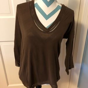 Brown women’s long sleeve shirt.